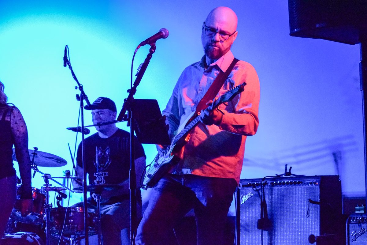 John Lawson playing guitar live